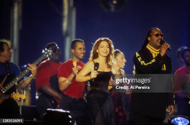 Musicians Gloria Estefan and Stevie Wonder perform at the Super Bowl XXXIII Halftime Show on January 31, 1999 in Miami.
