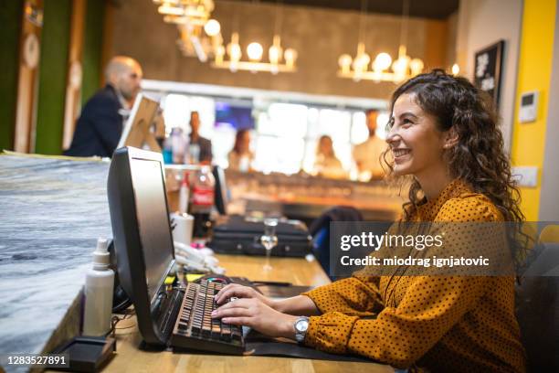 Hotel Receptionist Job Using Computer Hotel Worker On Computer Photos and Premium High Res Pictures - Getty ...