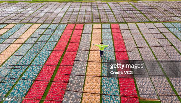 Aerial view of Guangdong gambiered silk spreading out at a factory on November 1, 2020 in Wuzhou, Guangxi Zhuang Autonomous Region of China....