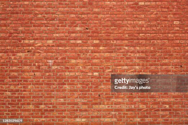 brick wall with broken and old bricks texture. - brick wall stock pictures, royalty-free photos & images