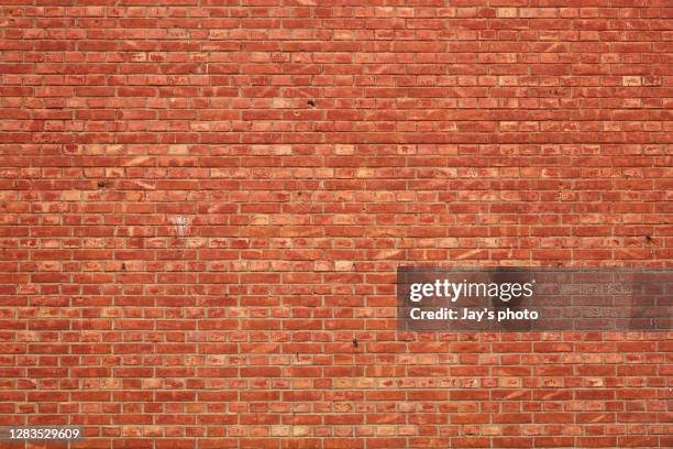 brick wall with broken and old bricks texture. - tijolo imagens e fotografias de stock