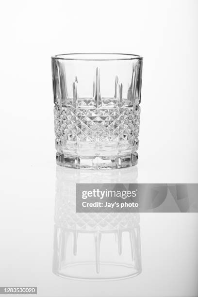 whiskey glass on a white background - jay space stock pictures, royalty-free photos & images