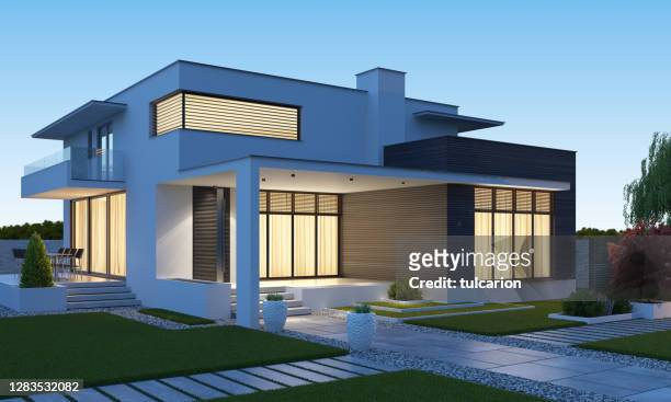 luxurious beautiful modern villa with front yard garden at sunset. - modern stock pictures, royalty-free photos & images
