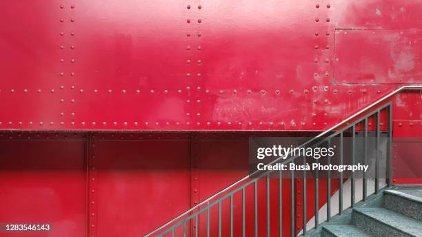 staircase with riveted metal panels in the background - metal rivets stock pictures, royalty-free photos & images