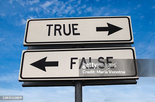 True vs false. White two street signs with arrow on metal pole with word. Directional road. Crossroads Road Sign, Two Arrow. Blue sky background. Two way road sign with text. True vs false. White two street signs with arrow on metal pole with word. Directional road. Crossroads Road Sign, Two Arrow. Blue sky background. Two way road sign with text.
