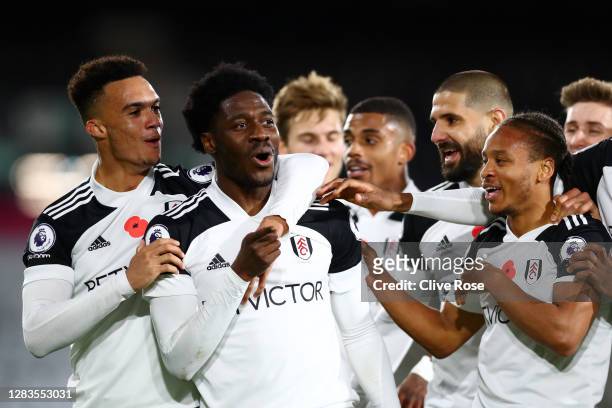 Ola Aina of Fulham celebrates with teammates after scoring his team's second goal during the Premier League match between Fulham and West Bromwich...