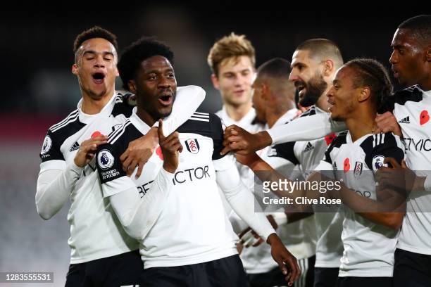 Ola Aina of Fulham celebrates with teammates after scoring his team's second goal during the Premier League match between Fulham and West Bromwich...