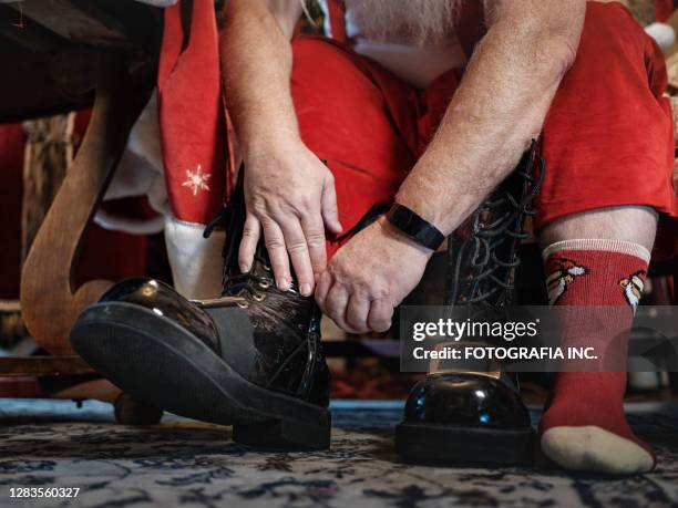 santa's hands getting dressed - changing clothes stock pictures, royalty-free photos & images