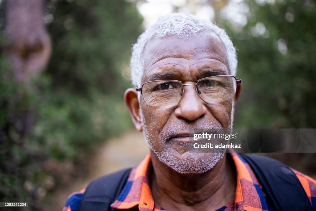 Senior Black Man Hiking in Nature