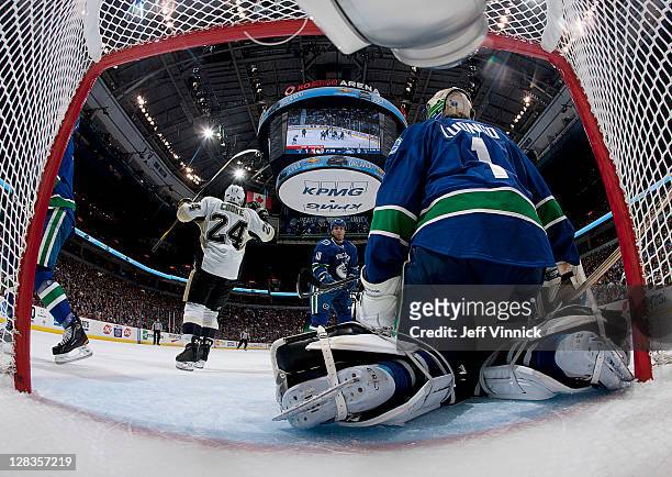 Matt Cooke of the Pittsburgh Penguins celebrates after scoring against Roberto Luongo of the Vancouver Canucks during the NHL game October 6, 2011 in...