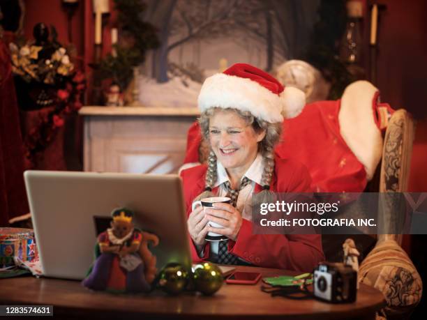 mrs.clause on a video conference call - mrs claus stock pictures, royalty-free photos & images