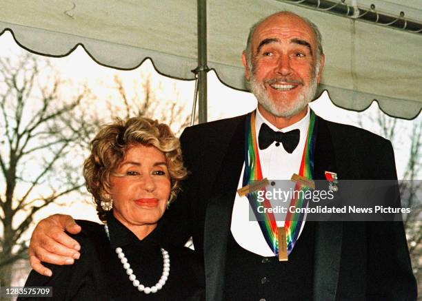 View of married couple, French-Moroccan artist Micheline Roquebrune Connery and Scottish actor Sean Connery as they arrive at the White House,...