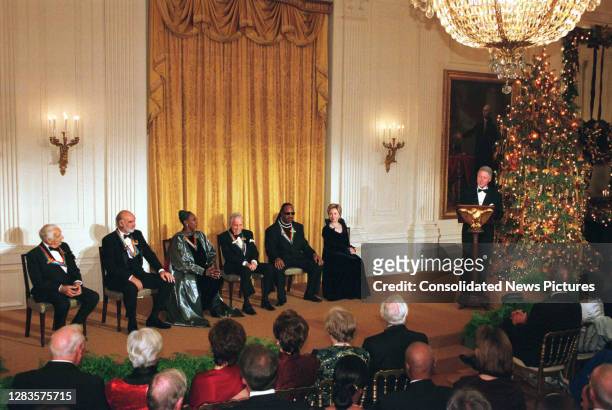 View of the 1999 Kennedy Center Honorees, seated with US First Lady Hillary Rodham Clinton , as they to US President Bill Clinton speak during a...