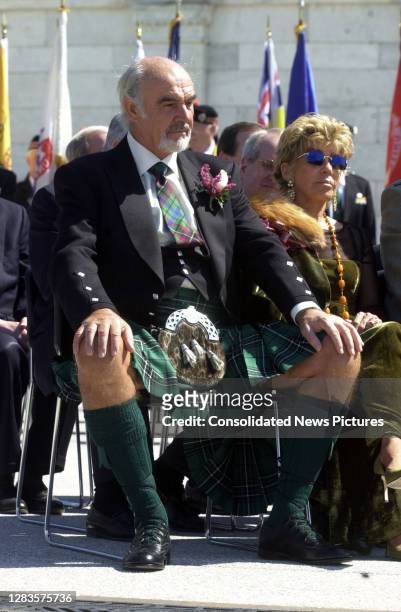 View of married couple, Scottish actor Sir Sean Connery and French-Moroccan artist Lady Micheline Roquebrune Connery, as they sit outside the US...