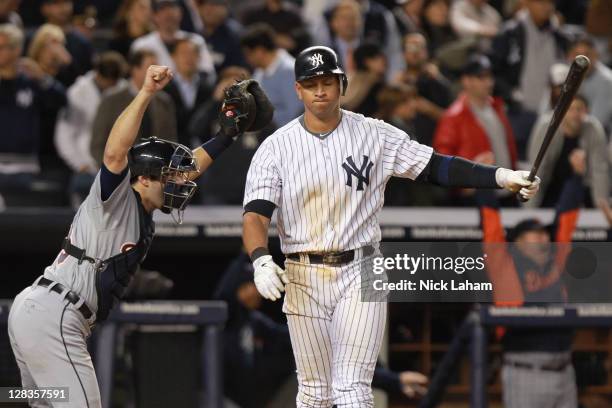 Alex Avila of the Detroit Tigers celebrates the Tigers 3-2 win as Alex Rodriguez of the New York Yankees reacts after striking out for the games...