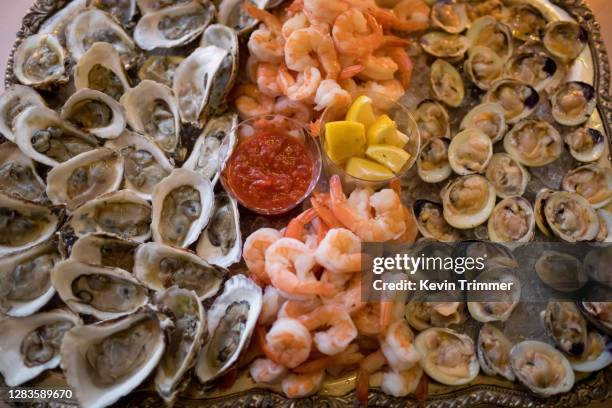 platter of shrimp, clams and oysters - clam seafood stock pictures, royalty-free photos & images