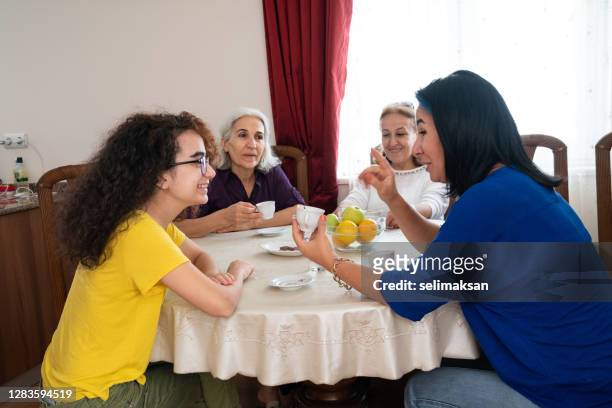 middle eastern family drinking turkish coffee - medium group of people imagens e fotografias de stock
