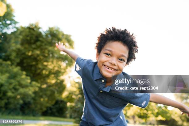 happiness and wellbeing - 8 year old stock pictures, royalty-free photos & images