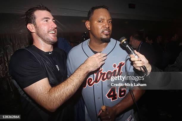 Justin Verlander and Jose Valverde of the Detroit Tigers celebrate in the locker room after they won 3-2 against the New York Yankees during Game...