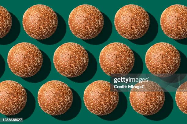 burger bun arrangement pattern - burger above stock pictures, royalty-free photos & images