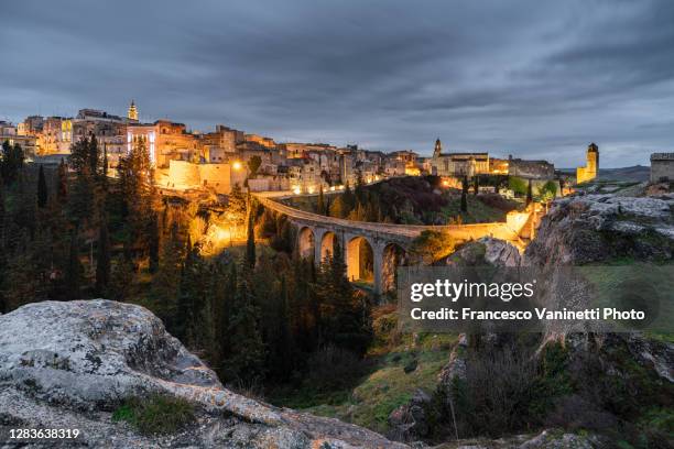 gravina in puglia at dusk, italy. - puglia italy stock pictures, royalty-free photos & images