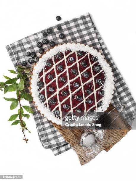 food photography of blueberry tart (pie) top view on a white background isolated close up - blueberry pie isolated stock pictures, royalty-free photos & images