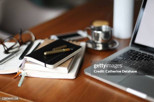 still life of things needed for working at home - pupitre fotografías e imágenes de stock