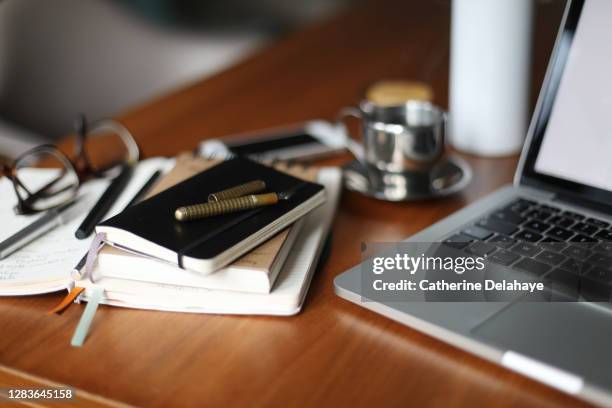 still life of things needed for working at home - desk stockfoto's en -beelden