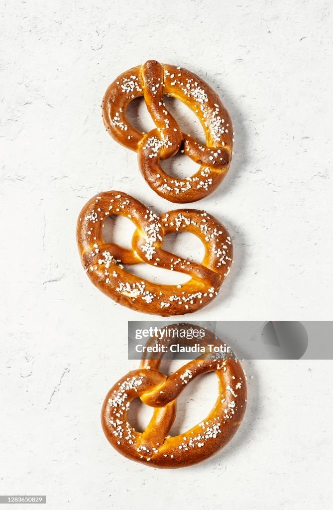 Soft pretzels on white background