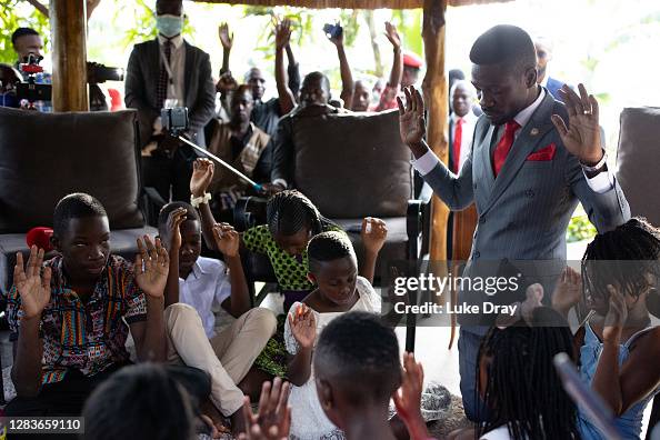 Bobi Wine prays with his children before leaving their house for the ...
