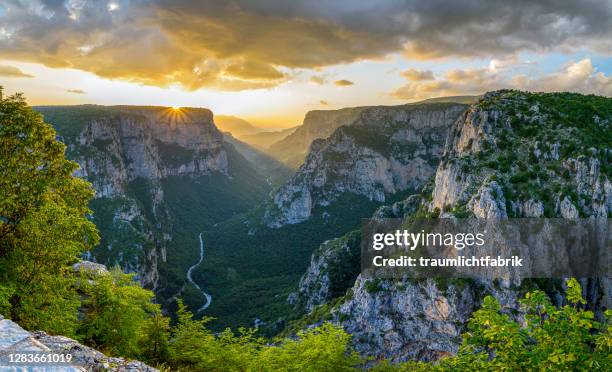 panoramic view of vikos canyon at sunset - epirus greece stock pictures, royalty-free photos & images