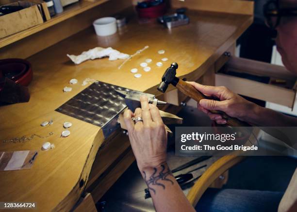 detail shot of woman making jewelry - anvil stock pictures, royalty-free photos & images