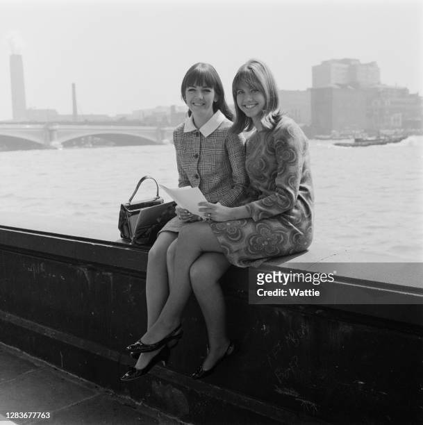 Singing duo Pat Carroll and Olivia Newton-John, aka Pat and Olivia, on the River Thames in London, UK, 1st June 1966.