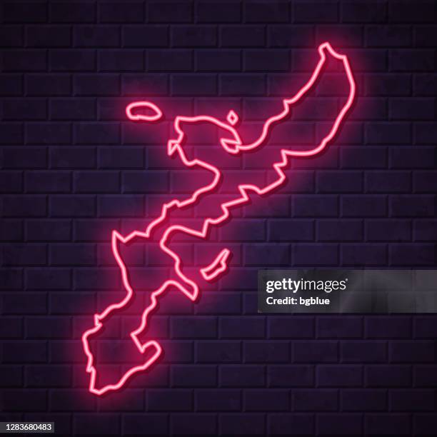 okinawa island map - glowing neon sign on brick wall background - okinawa prefecture stock illustrations