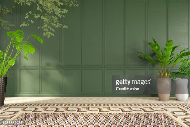 lege klassieke groene muur met installaties - woonruimte stockfoto's en -beelden
