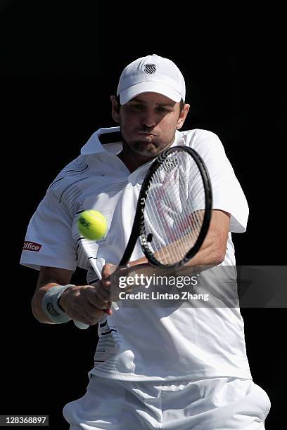 Mardy Fish of the United States plays a backhard in his quarter final match against Bernard Tomic of Australia during day five of the Rakuten Open at...