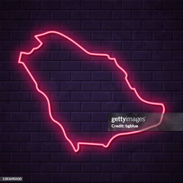 saudi arabia map - glowing neon sign on brick wall background - riyadh stock illustrations