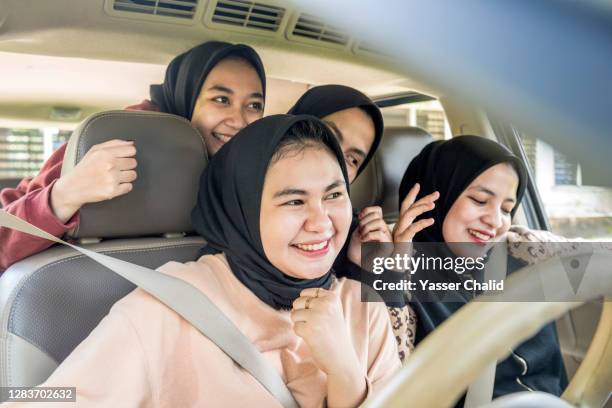 girls in a car - kids fun indonesia stock pictures, royalty-free photos & images