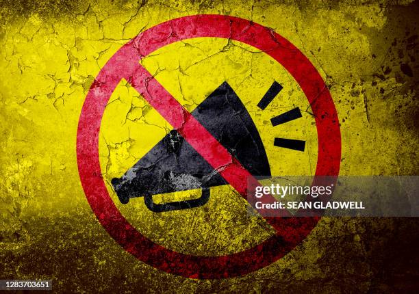 no noise symbol on wall - protestor stock pictures, royalty-free photos & images