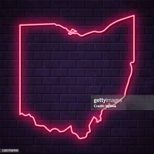 ohio map - glowing neon sign on brick wall background - led light wall stock illustrations