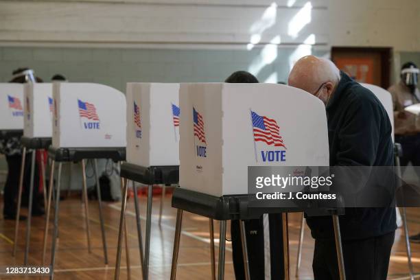 Residents of Baltimore City cast their votes in the U.S. Presidential and local congressional elections at Dickey Hill Elememtery School on November...