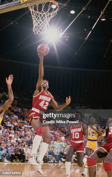 Mike Woodson, Shooting Guard for the Houston Rockets makes a one handed lay up to the basket during the NBA Pacific Division basketball game against...