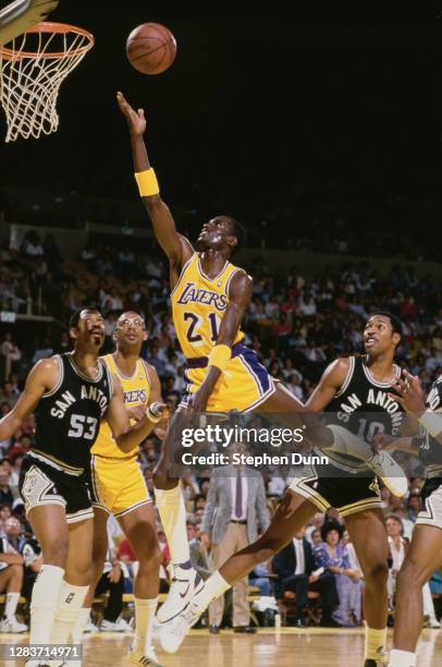 Michael Cooper, Shooting Guard for the Los Angeles Lakers makes a one handed lay up to the basket during the NBA Pacific Division basketball game...