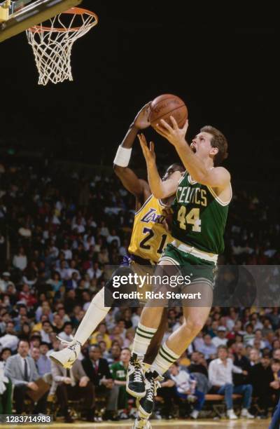 Danny Ainge, Shooting Guard for the Boston Celtics drives to the basket with Michael Cooper of the Los Angeles Lakers during their NBA Pacific...