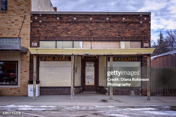 the old pine ridge taxidermy shop in hay spring, nebraska on main street, u.s. route 20 - diana center stock pictures, royalty-free photos & images