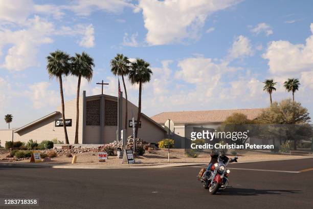 Jeremy Clarke of Peoria, AZ leaves a polling location on an Indian motorcycle after voting at Radiant Church Sun City on November 03, 2020 in Sun...
