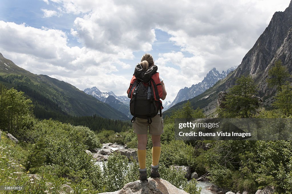 Woman hiking in a pristine valley