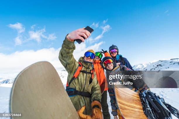 winter holidays in ski resort - snowboarding stock pictures, royalty-free photos & images