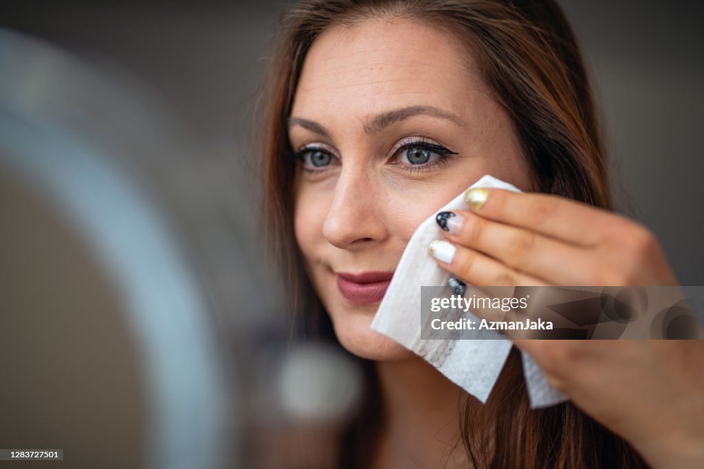 Close Up Of A Woman Removing Makeup With Wet Wipe