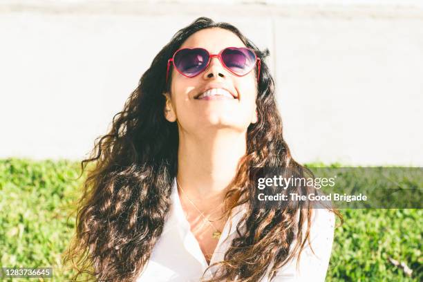 beautiful woman enjoying sunshine outdoors - vitamin d stock pictures, royalty-free photos & images